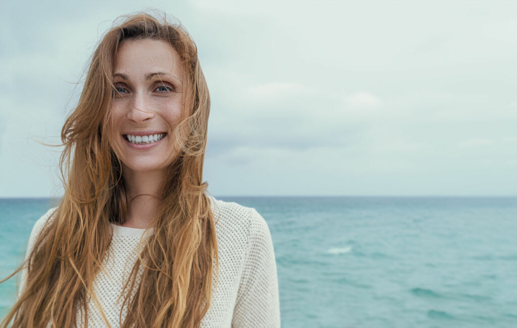 71326730 coast portrait of laughing woman